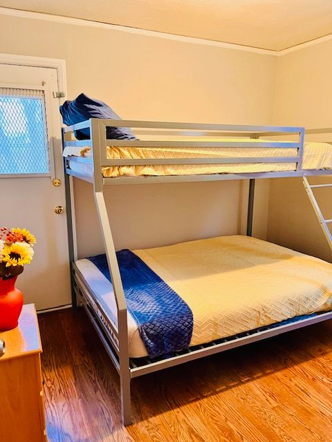 bedroom featuring wood-type flooring