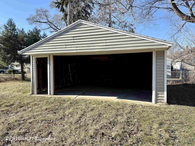 garage featuring a lawn