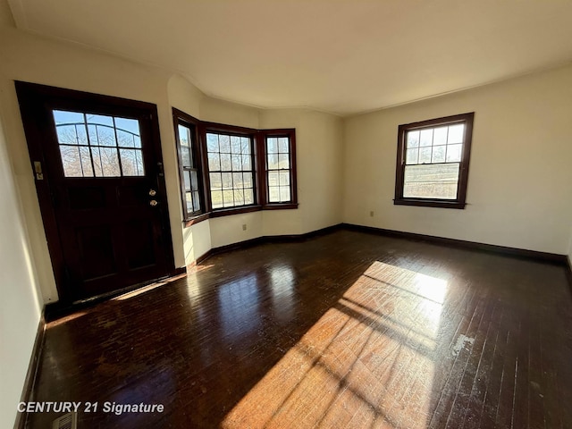 foyer with dark hardwood / wood-style floors