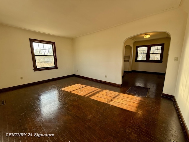 empty room featuring dark hardwood / wood-style flooring