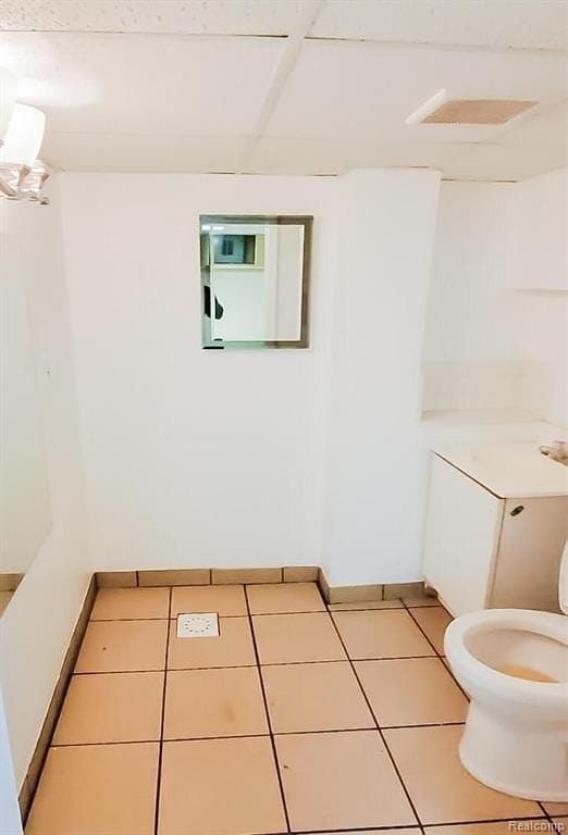 bathroom featuring toilet and tile patterned floors