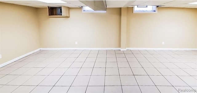 basement featuring a drop ceiling