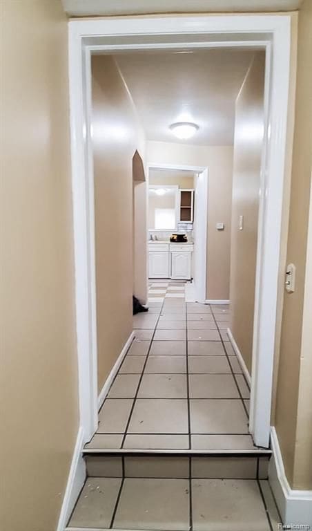 hallway with light tile patterned flooring