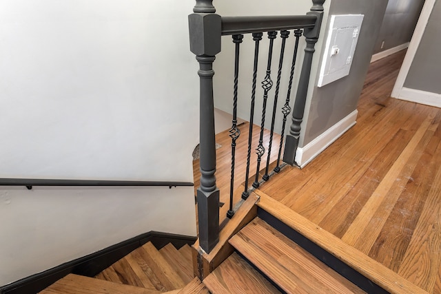 staircase featuring hardwood / wood-style floors