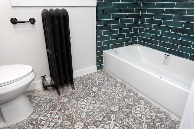 bathroom with toilet, shower / bathtub combination, tile patterned floors, and radiator heating unit