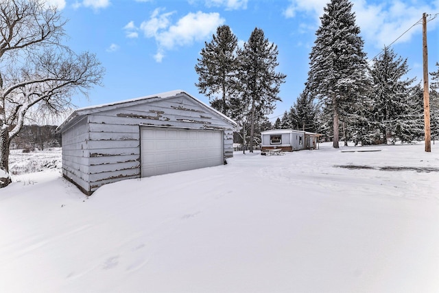 view of snow covered garage