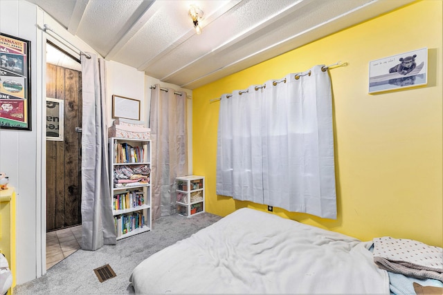 bedroom featuring light colored carpet