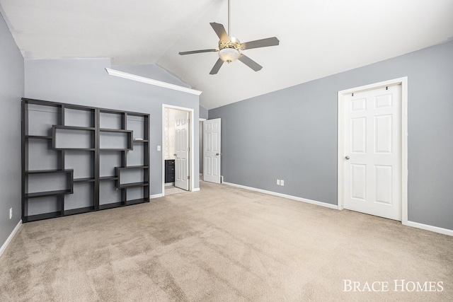 unfurnished bedroom with lofted ceiling, ceiling fan, and light colored carpet