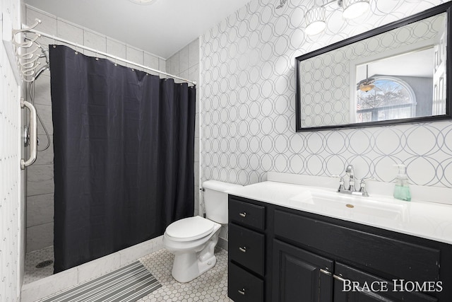 bathroom with a shower with curtain, tile patterned flooring, vanity, and toilet