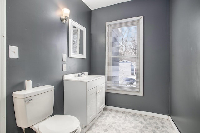 bathroom with toilet and vanity