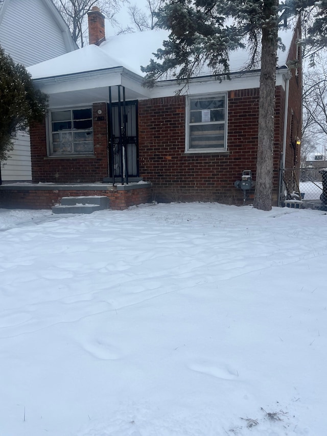 view of snow covered property