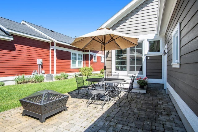 5 Georgia Ct, Pentwater, MI 49449 - view of patio with an outdoor fire pit, cooling unit, and outdoor dining space