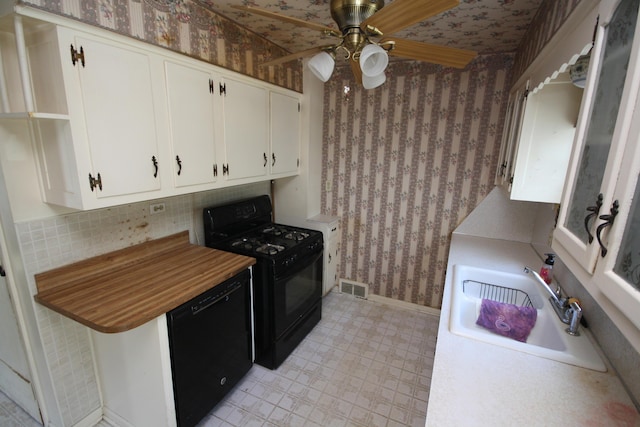 kitchen with black appliances, backsplash, white cabinets, ceiling fan, and sink