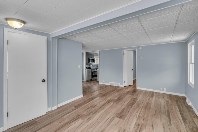 unfurnished room featuring light wood-type flooring