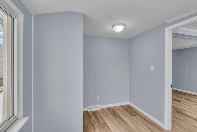 spare room featuring light hardwood / wood-style floors