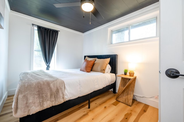 bedroom with ceiling fan and hardwood / wood-style floors