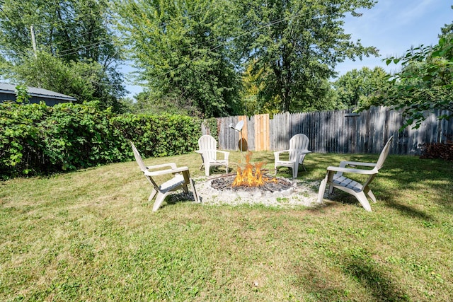 view of yard with an outdoor fire pit