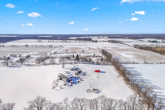 snowy aerial view featuring a rural view