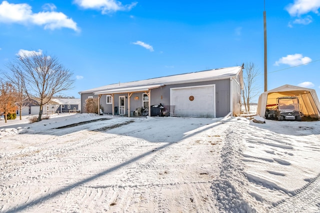 view of snow covered garage