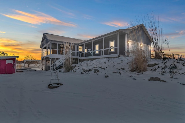 view of front of house with a sunroom