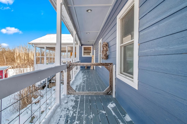 view of snow covered deck