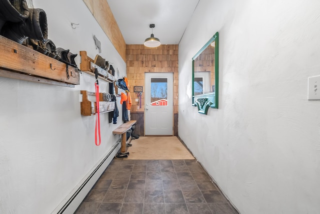 doorway to outside featuring a baseboard heating unit