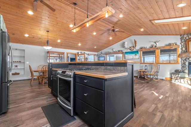 kitchen featuring stainless steel appliances, a center island, ceiling fan, pendant lighting, and wood ceiling