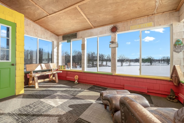 sunroom featuring vaulted ceiling, wood ceiling, and a water view