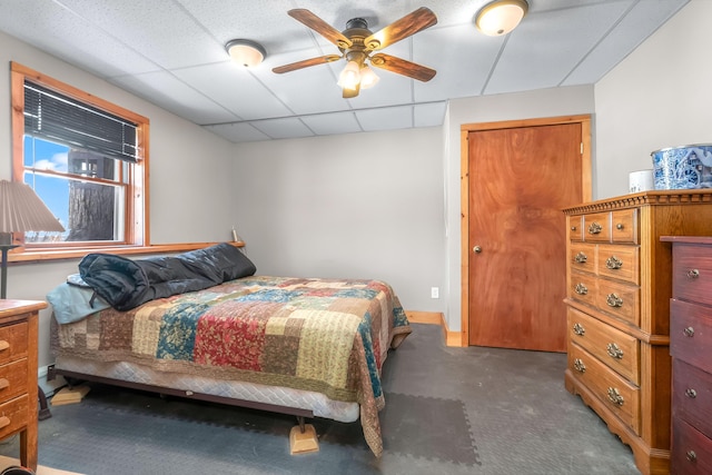 bedroom featuring a paneled ceiling and ceiling fan