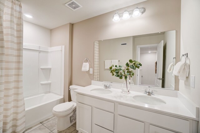 full bathroom with tile patterned flooring, shower / tub combo with curtain, vanity, and toilet