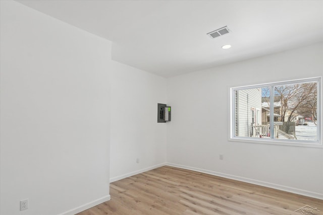 unfurnished room featuring light hardwood / wood-style flooring