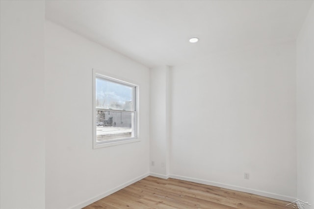 unfurnished room featuring light hardwood / wood-style flooring