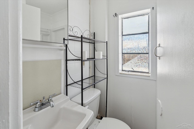 bathroom with sink and toilet