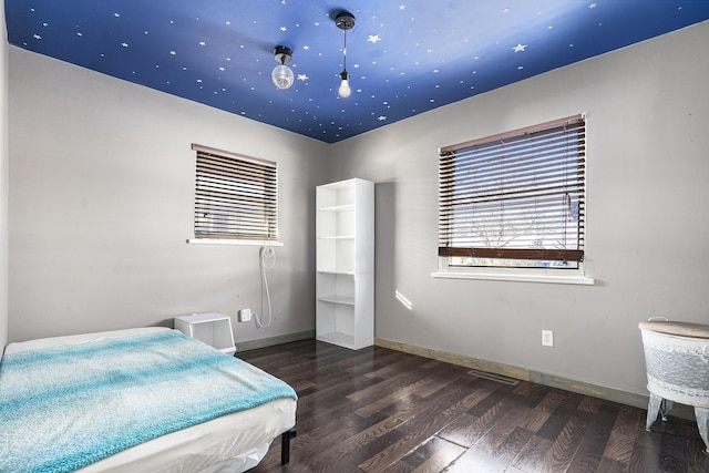 bedroom featuring dark wood-type flooring