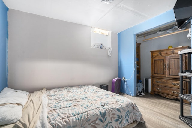 bedroom with light hardwood / wood-style flooring