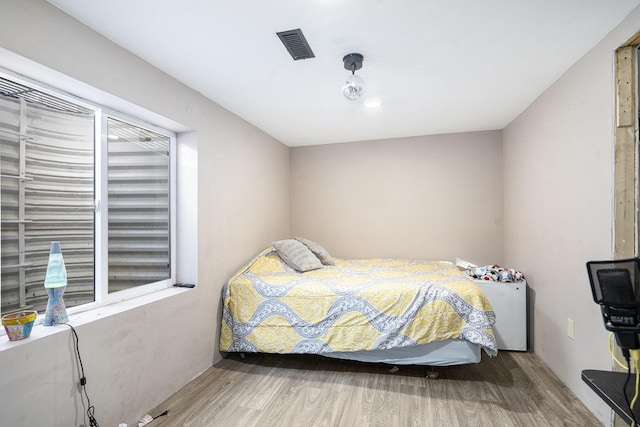 bedroom featuring hardwood / wood-style flooring