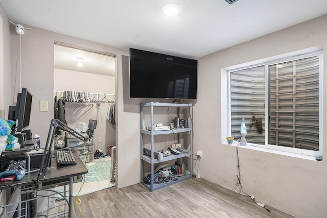 office space with wood-type flooring