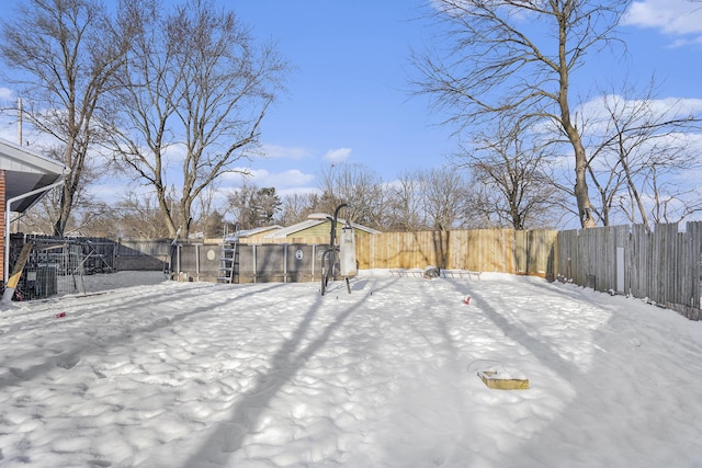 view of yard layered in snow