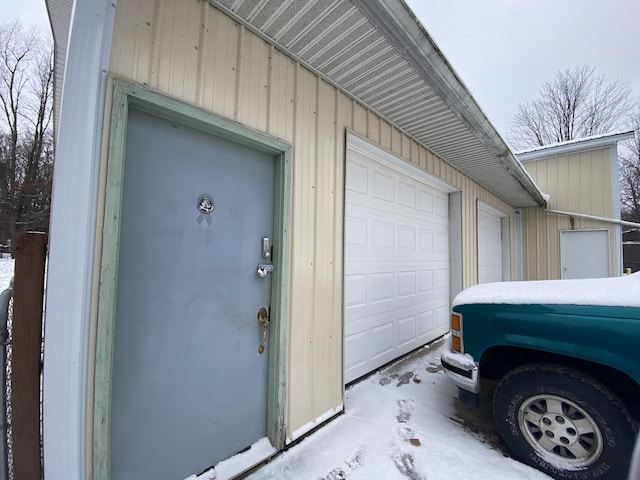 view of snow covered garage