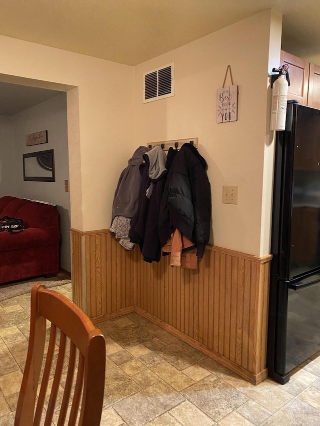 interior space featuring wood walls