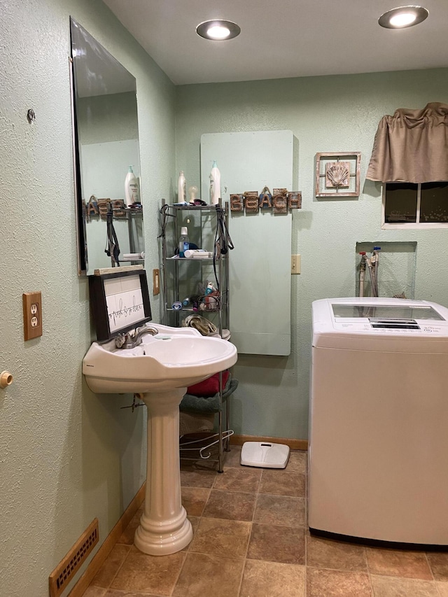 bathroom featuring washer / clothes dryer