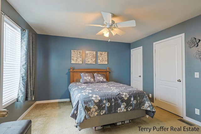 carpeted bedroom with ceiling fan