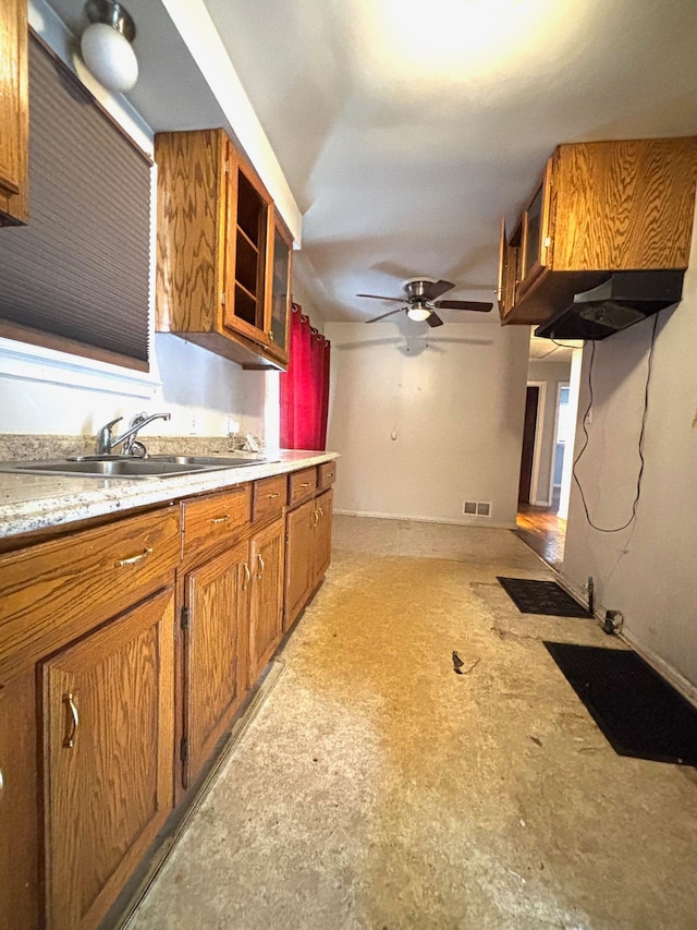 kitchen with ceiling fan and sink