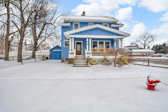 view of front of property with a porch and a storage unit