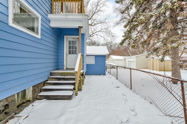 view of snow covered property entrance