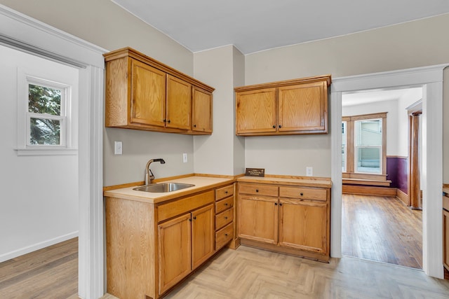 kitchen with sink and light parquet flooring