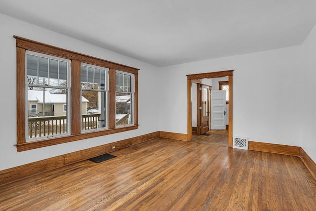 unfurnished room featuring wood-type flooring