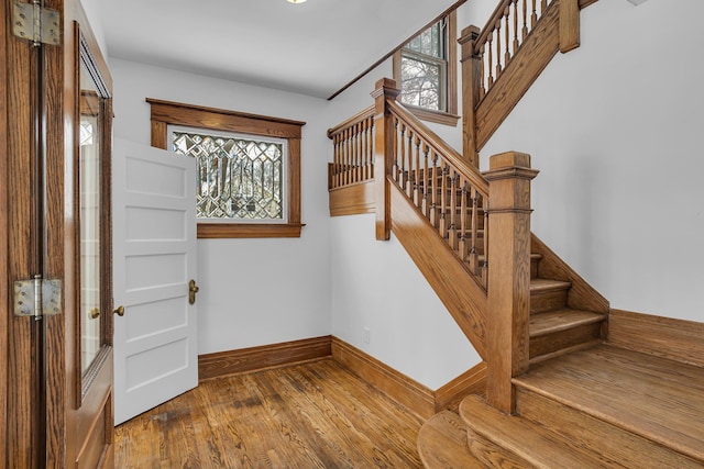 stairs with hardwood / wood-style flooring