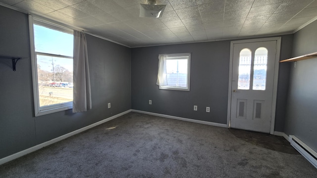 416 S Michigan Ave, Manton, MI 49663 - carpeted foyer with baseboard heating and baseboards