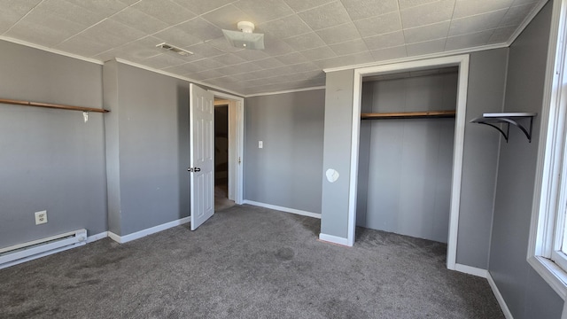 416 S Michigan Ave, Manton, MI 49663 - unfurnished bedroom featuring a baseboard heating unit, ornamental molding, carpet floors, a closet, and baseboards